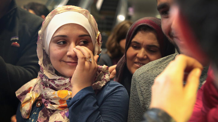 Syrian refugee Baraa Haj Khalaf wipes away a tear after arriving at O’Hare Airport with her family on a flight from Istanbul, Turkey on February 7, 2017. SCOTT OLSON VIA GETTY IMAGES