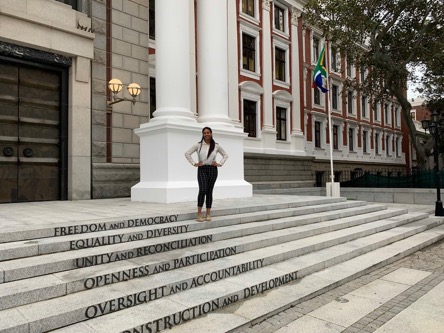 Danielle standing in front of Parliament before going to sit in on the Department of Home Affairs Portfolio Committee Elections and meeting.