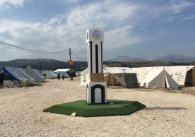 A replica of the Clock Tower in Homs, which became the city’s most famous gathering point during anti-regime demonstrations in 2011. It was built by the Syrian residents of the Katsikas refugee camp, in Greece’s Epirus region. The clock is set to the time they entered the camp and a caption underneath it reads: “Time stopped when we came here” – September 2016 (Andres Barkil-Oteo/SyriaUntold)